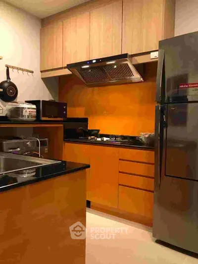 Modern kitchen with sleek cabinets and stainless steel appliances