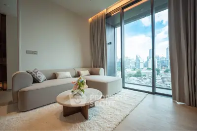 Luxurious living room with stunning city view, featuring elegant sofa and modern decor.