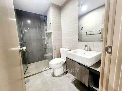 Modern bathroom with sleek design and glass shower enclosure