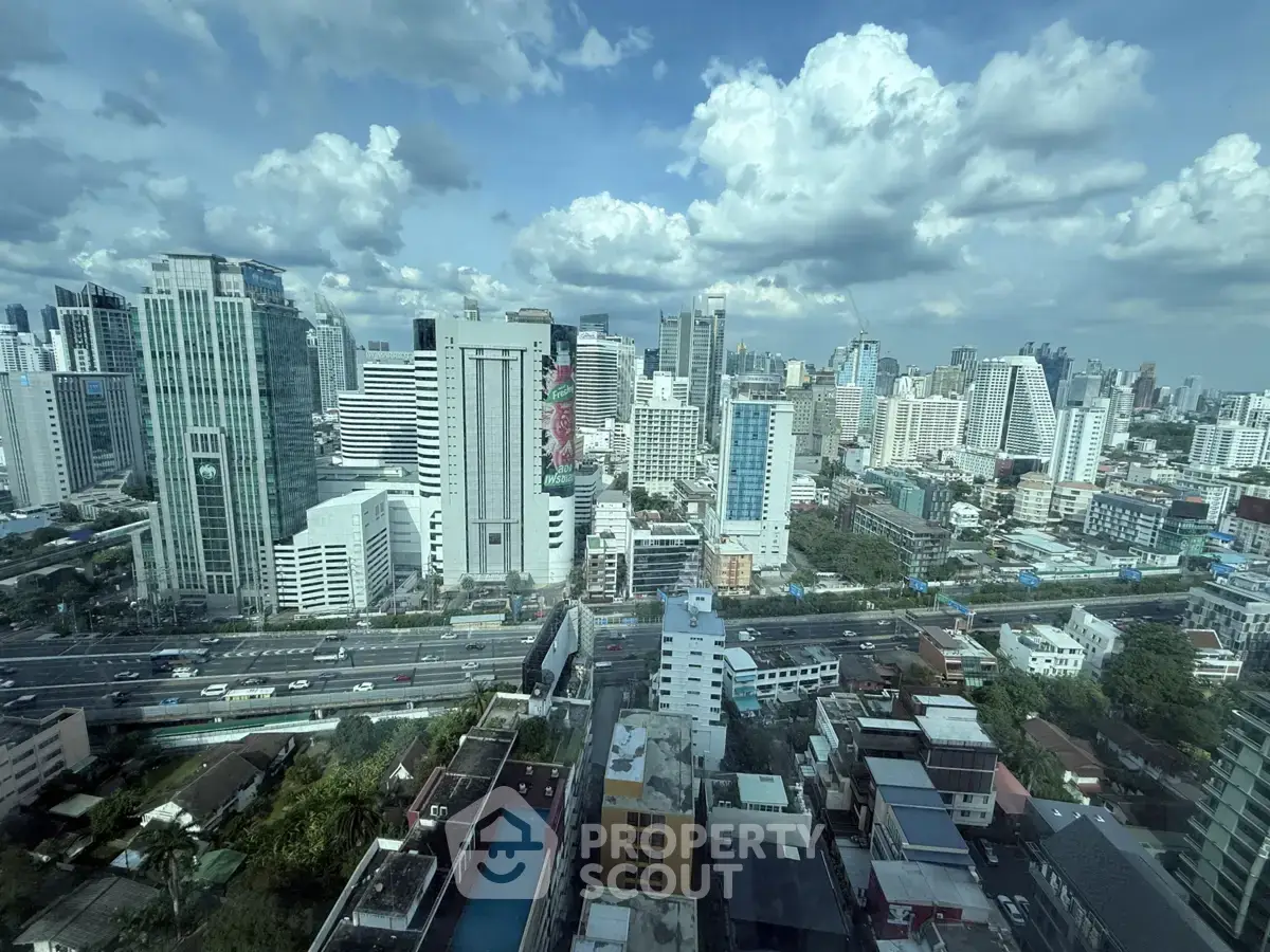Stunning cityscape view from high-rise building showcasing urban skyline and vibrant city life.
