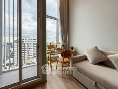 Modern living room with balcony view in high-rise apartment