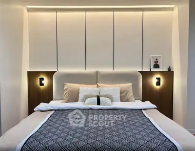 Luxurious modern bedroom with elegant lighting and plush bedding