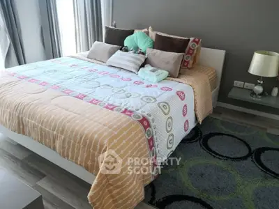 Cozy bedroom with stylish decor and ample natural light