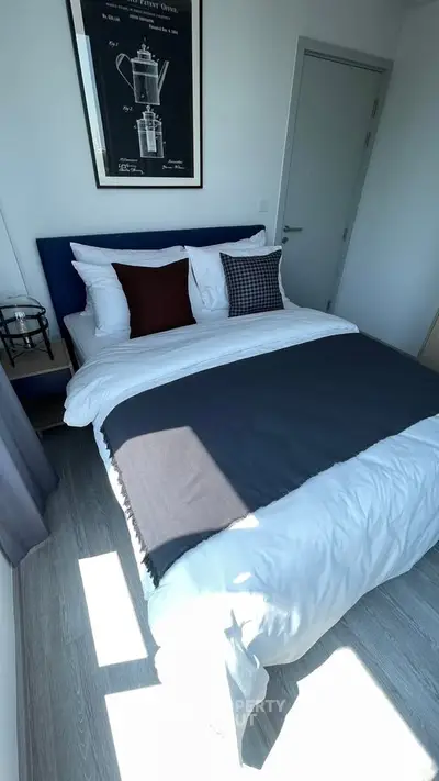 Cozy modern bedroom with stylish decor and natural light