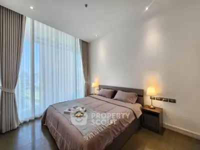 Elegant bedroom with large windows and cozy lighting in modern apartment