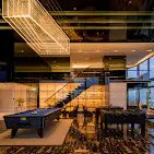 Luxurious modern living room with pool table and elegant lighting
