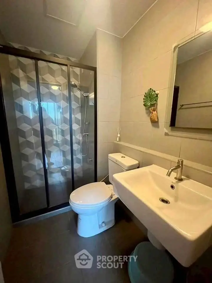 Modern bathroom with sleek shower and stylish fixtures