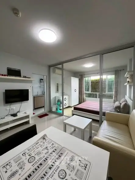 Modern studio apartment with open layout and balcony view