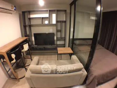 Modern studio apartment with cozy living area and stylish furniture