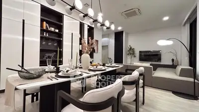 Modern dining and living room with elegant decor and stylish lighting