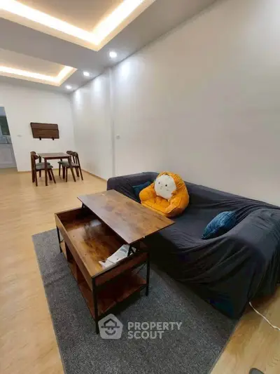 Modern living room with stylish furniture and cozy ambiance, perfect for relaxation and entertaining guests.