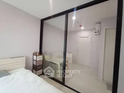 Modern bedroom with sliding glass doors and minimalist decor