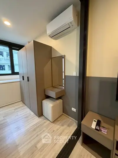 Modern bedroom with sleek air conditioning and stylish furniture