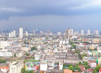 Stunning cityscape view showcasing a vibrant urban skyline with diverse architecture and lush greenery.