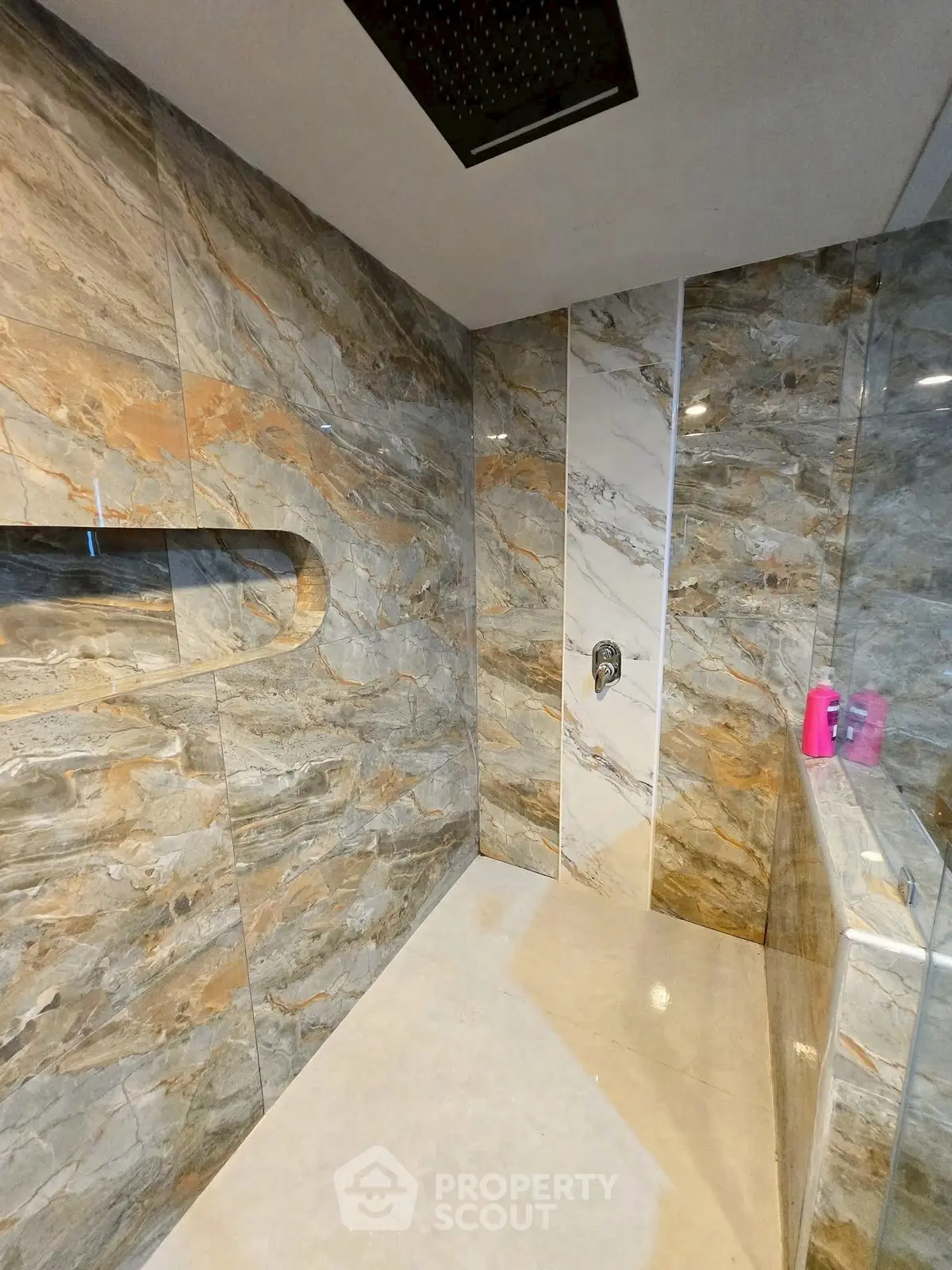 Luxurious marble bathroom with modern shower design