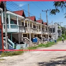 Charming row of colorful townhouses with unique architectural design and spacious balconies.