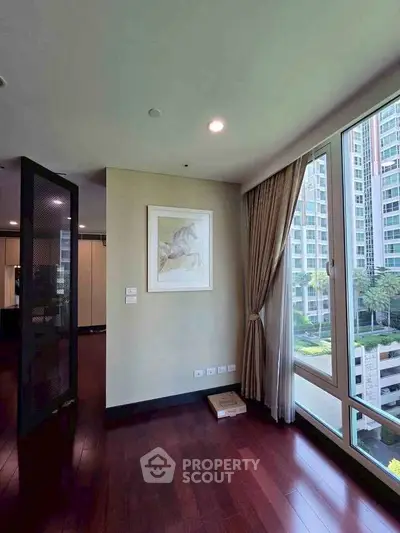 Spacious corner unit with large windows offering a stunning view of the cityscape.