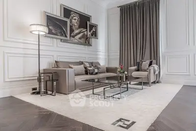 Luxurious living room with elegant decor, featuring plush seating and stylish artwork, perfect for sophisticated living.