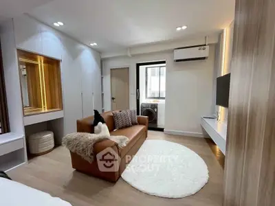 Modern living room with cozy sofa and stylish decor in a bright apartment.