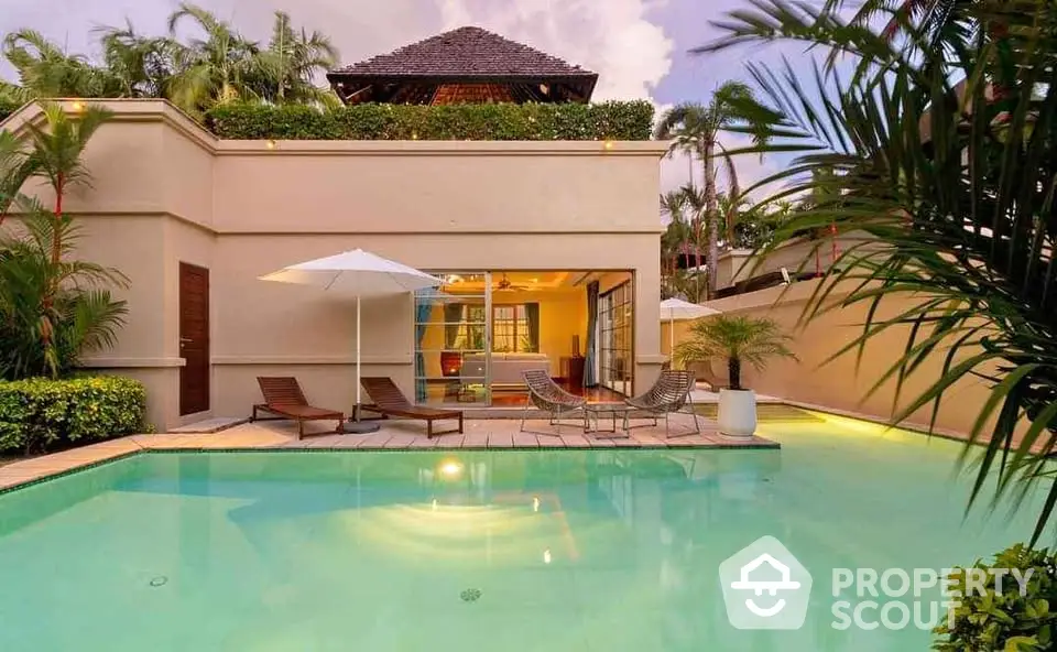 Luxurious villa with private pool and lush greenery, perfect for relaxation and entertainment.