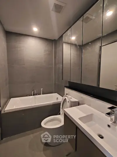 Modern bathroom with sleek design and bathtub in luxury apartment