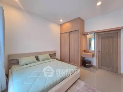 Spacious bedroom with modern design and ample natural light