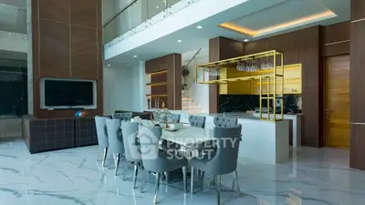 Luxurious open-plan living and dining area with modern decor and elegant furnishings.