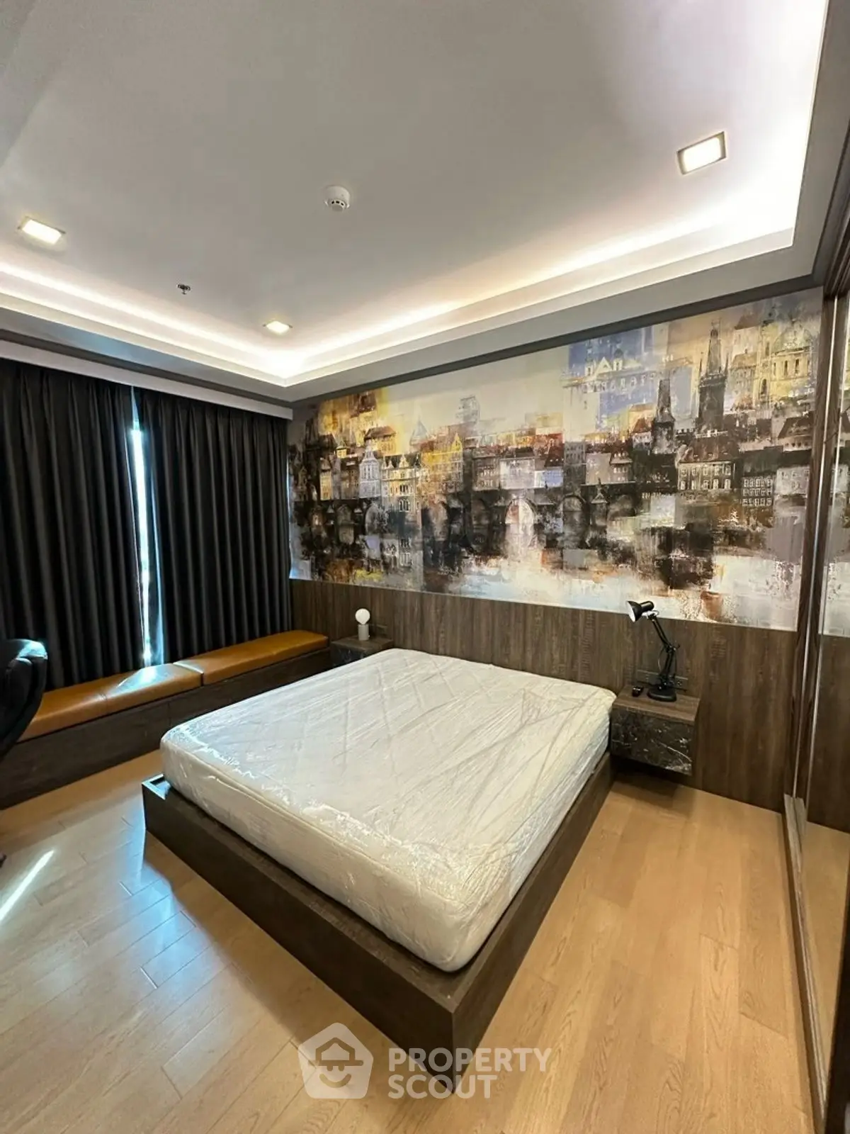 Modern bedroom with artistic wall mural and cozy lighting