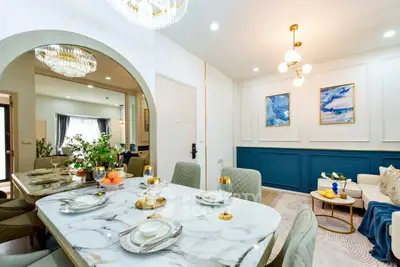 Luxurious dining and living area with elegant decor and marble table