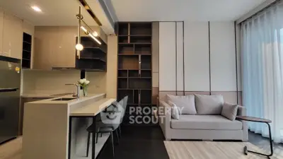 Modern living room with sleek kitchen and cozy sofa in open layout apartment