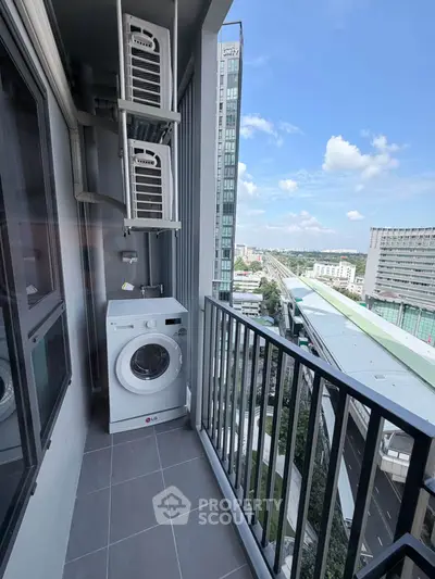 High-rise balcony with washing machine and stunning city view