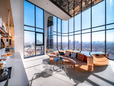 Luxurious high-rise living room with panoramic city views and modern decor