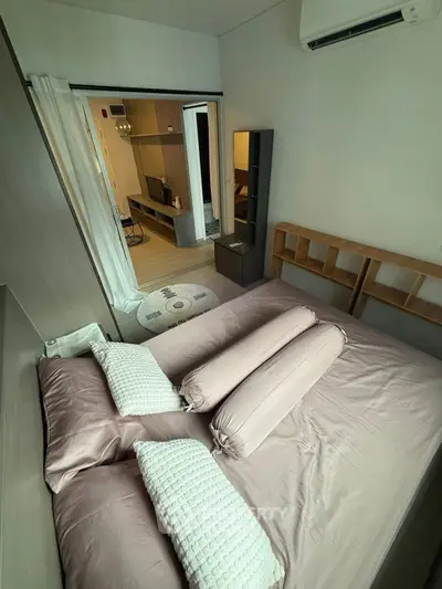 Modern bedroom with stylish decor and open layout in a contemporary apartment.