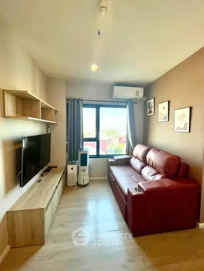 Cozy living room with modern decor and large window view