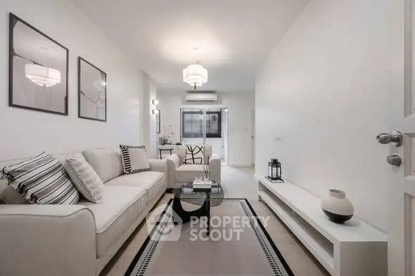 Elegant modern living room with stylish decor and neutral tones, perfect for relaxation and entertaining.