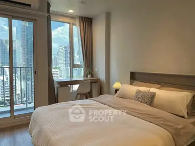 Modern bedroom with city view and cozy decor