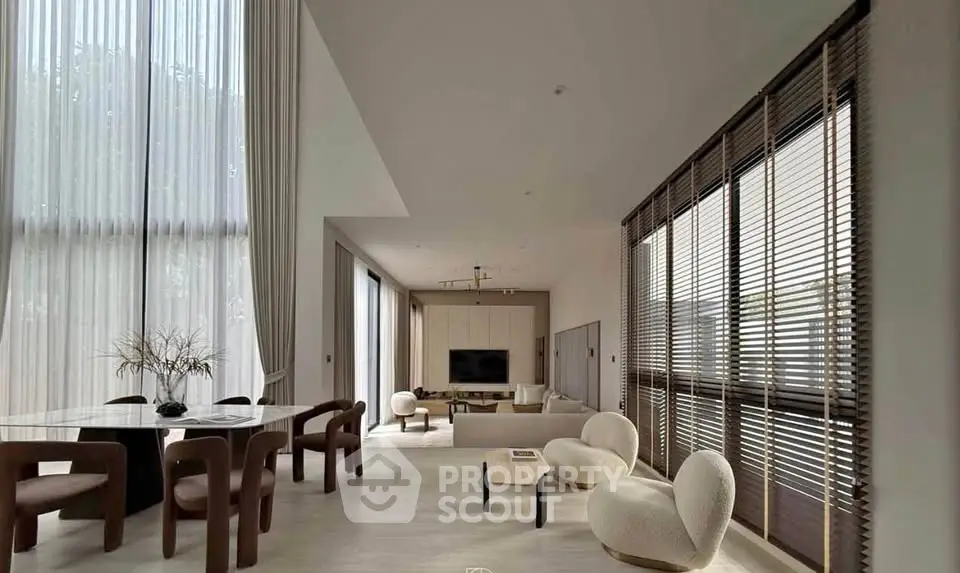 Luxurious modern living room with high ceilings and elegant furniture