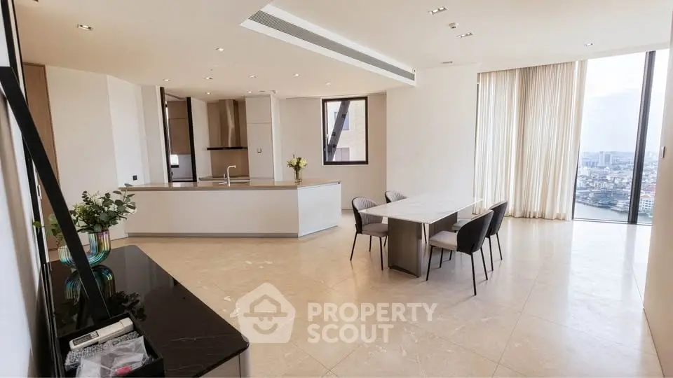 Luxurious open-plan living and dining area with panoramic city views