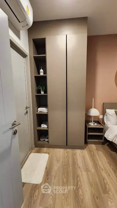 Modern bedroom with sleek wardrobe and stylish decor