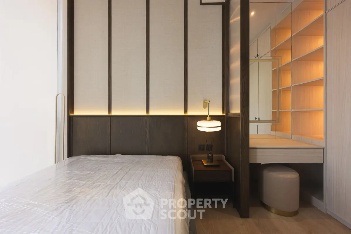 Modern bedroom with elegant lighting and built-in storage