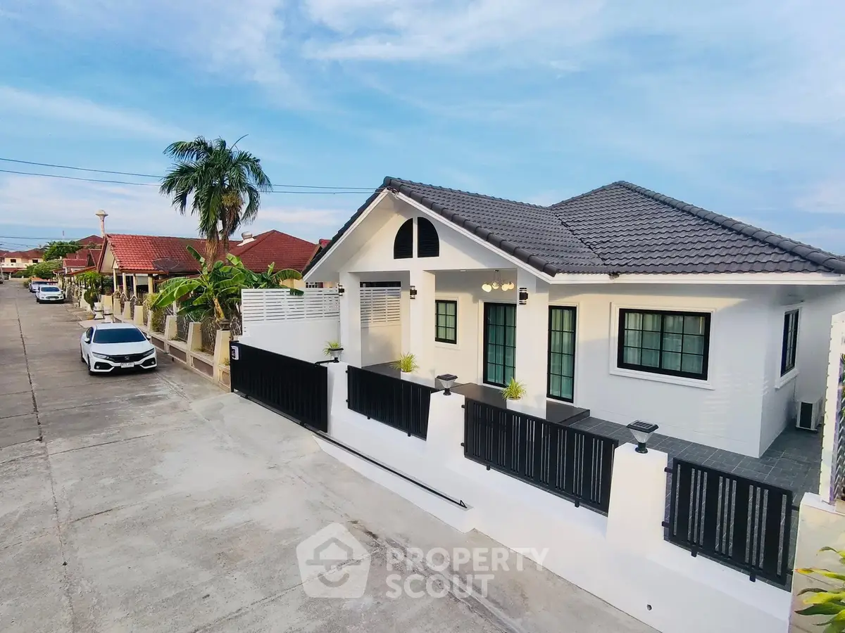 Charming suburban house with modern design and spacious driveway in a tranquil neighborhood.