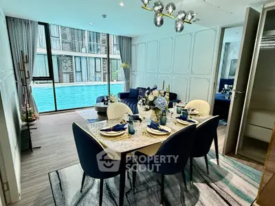 Luxurious dining area with pool view in modern apartment