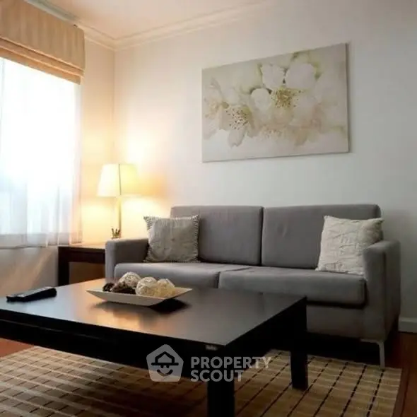 Cozy living room with modern gray sofa and elegant decor