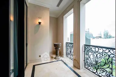 Elegant balcony with ornate railings and city view in luxury apartment