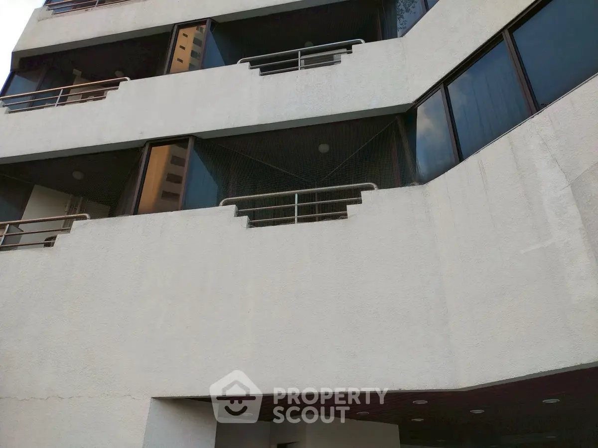 Modern building exterior with unique architectural design and large windows