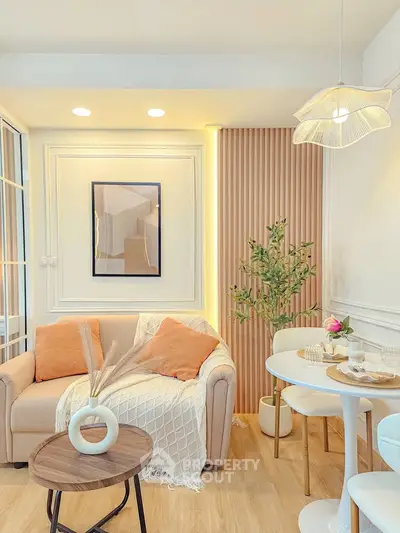 Chic and cozy living room with modern decor and natural light, perfect for relaxation and entertaining.