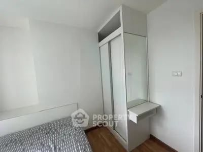 Modern bedroom with sleek wardrobe and minimalist design