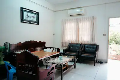 Cozy living room with classic wooden furniture and air conditioning
