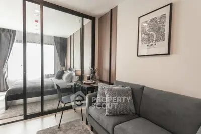 Modern living room with cozy sofa and stylish decor in a contemporary apartment.