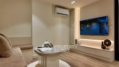 Modern living room with sleek design and ambient lighting